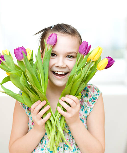 istock Happy girl with flowers 519825552