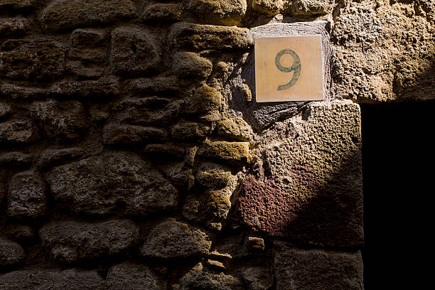 istock Number nine shining on a rock wall 519825746