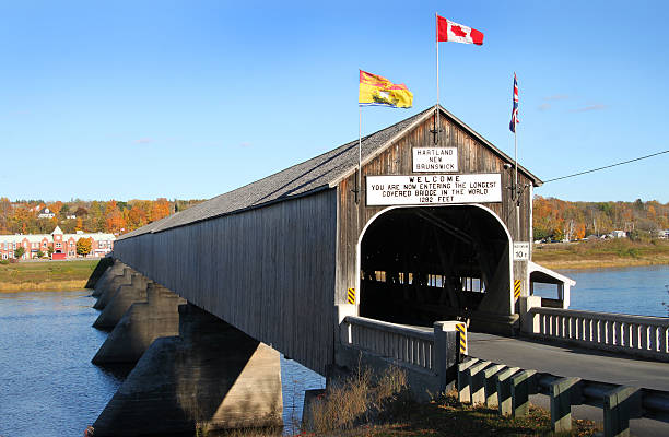 Hartland wooden covered bridge The longest wooden covered bridge in the world located in Hartland, New Brunwick, Canada in Autumn time new brunswick canada photos stock pictures, royalty-free photos & images