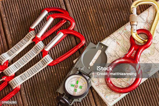 Compass On Mapclimbing Stock Photo - Download Image Now - Carabiner, Hiking, Mountain
