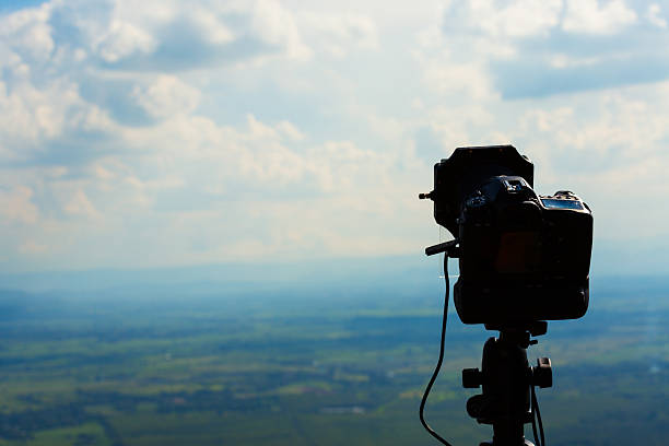 istock Camera and lens taking photograph 519826773