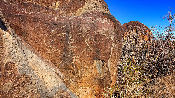 istock Face Petroglyph at Three Rivers Petroglyph site in New Mexico 519827136