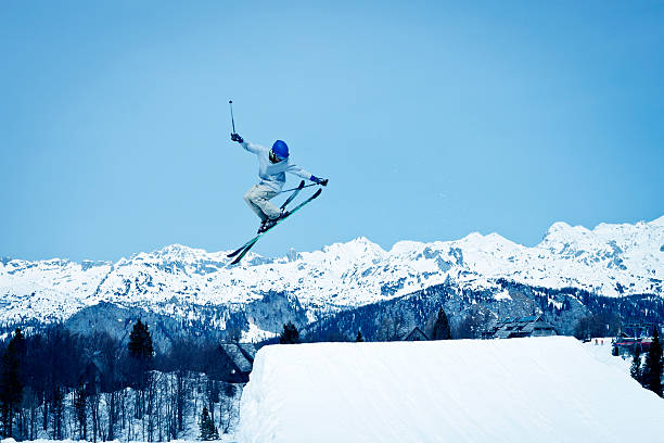 istock Young skier jumping and doing a stunt 519827598