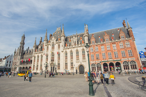 Bruges, Belgium - May 17, 2014: Grote market square in Bruges. The Bruges town is UNESCO world heritage listed for its medieval center.