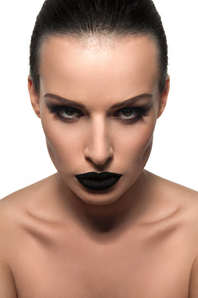 istock Beauty brunette model with black caviar on his lips 519828659