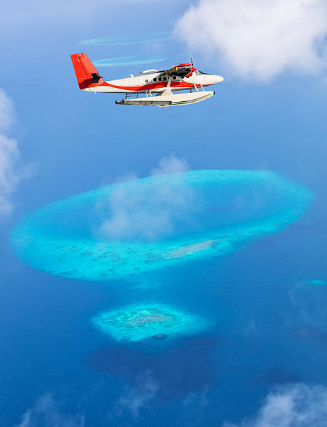 istock Sea plane flying above Maldives islands 519828986
