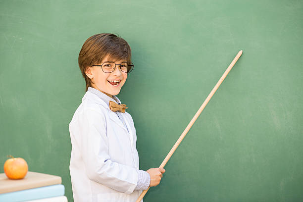 istock Education, children.  Happy boy in elementary classroom. 519829416