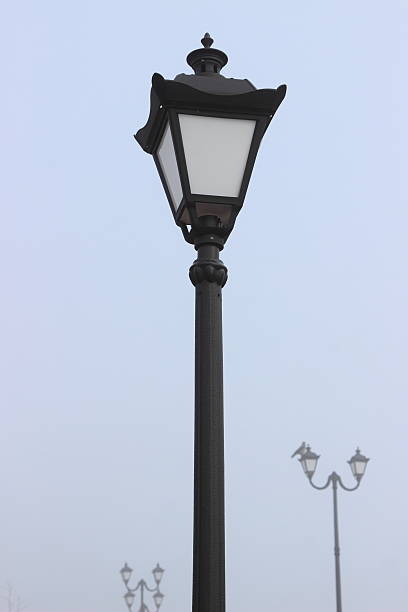 istock black street lamp post against the sky 519830130