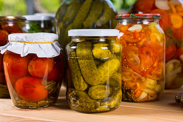 istock Jars of Preserved Vegetables on Wooden Table 519831344