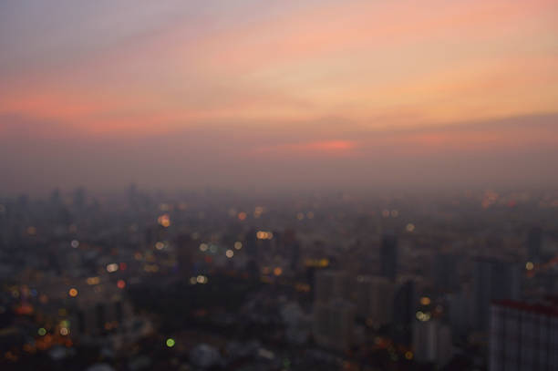 istock Blurred aerial view of cityscape on warm light sundown 519832450