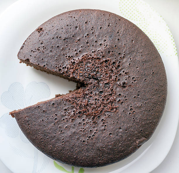 istock Chocolate biscuit cake, one piece cutted out. 519832534
