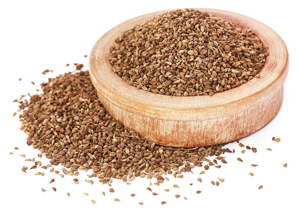 istock Ajwain seeds in a wooden bowl over white background 519834094