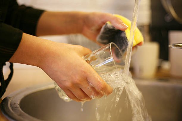 istock Woman's hands cleaning glass. 519837718