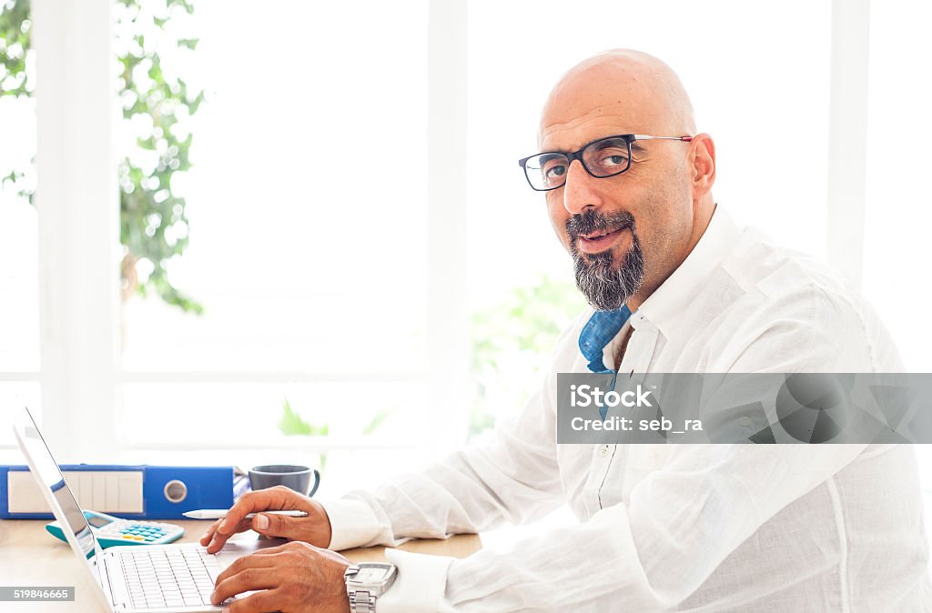 Working man on computer Adult Stock Photo