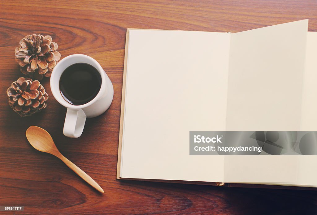 Blank notebook and coffee with retro filter effect Autumn Stock Photo