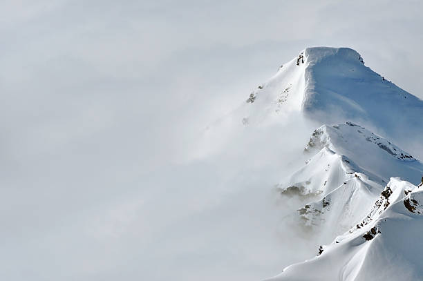 istock Fog above a winter mountain ridge 519848763