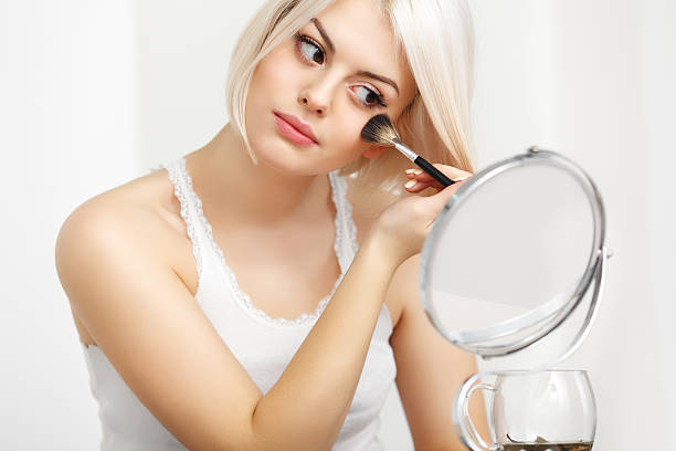 istock Beautiful Woman Doing Daily Dakeup. 519849257