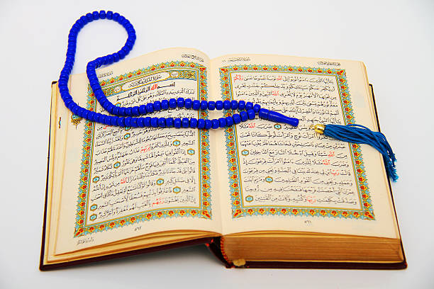 istock prayer beads and Qoran 519849343