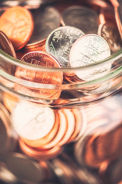 istock Donation jar overflowing with money 519849453