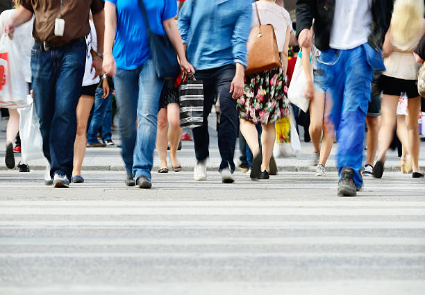 istock Pedestrians crossing sunlit street 519850175