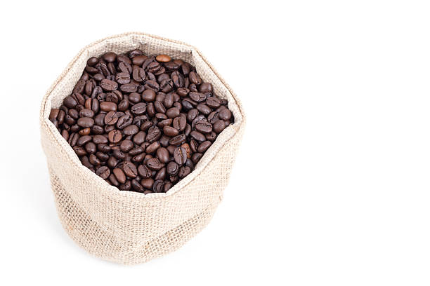 istock coffee beans in bag isolated on white background 519861399