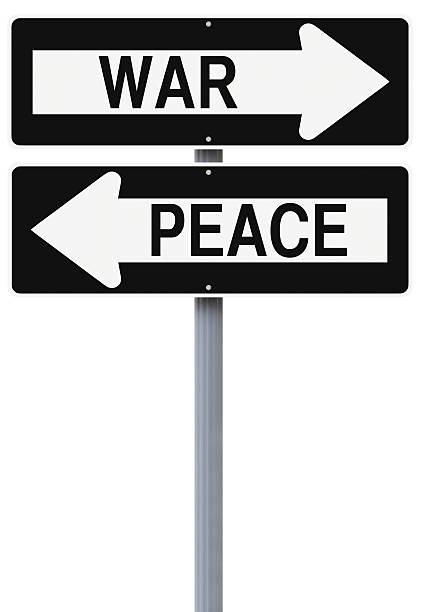 krieg oder frieden - conflict one way sign road sign stock-fotos und bilder