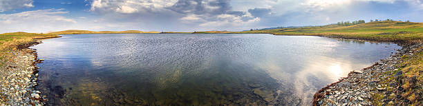 Steppe lake with reflections Panorama of big lake with reflections of sky. Spring south ural stock pictures, royalty-free photos & images