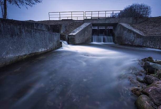 istock Long exposure photo of dam on river. 519862182