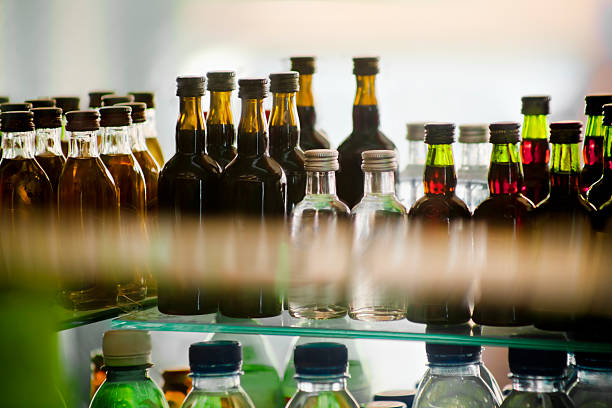 istock Bottles in a shop window. 519862557