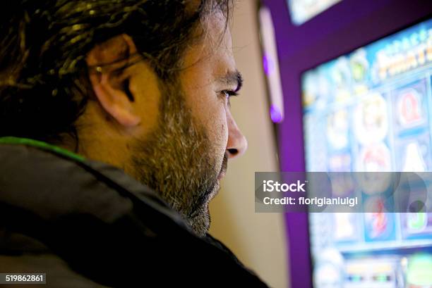 Man Play Front To The Slot Stock Photo - Download Image Now - Adult, Close-up, Computer Monitor