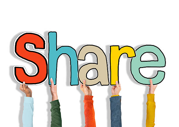 istock Diverse Group of Hands Holding Word Share 519863065