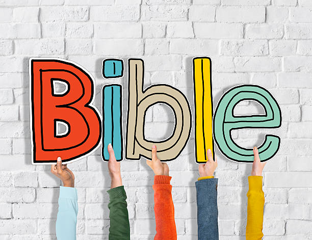 istock Diverse Group of Hands Holding Word Bible 519863171