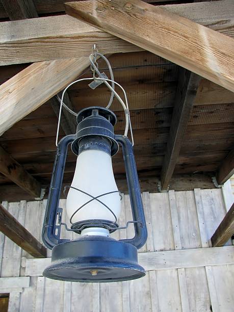istock Rusty blue lantern hanging in an old shed 519863826