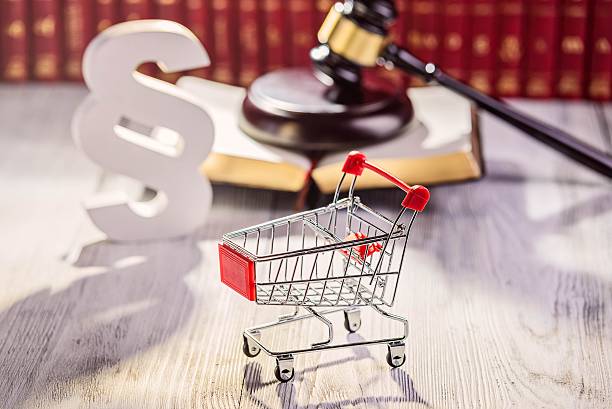 Little trolley - pushcart with the symbols of law Little trolley - pushcart with the symbols of law in court library with legal codes. Commercial law concept shorthand photos stock pictures, royalty-free photos & images