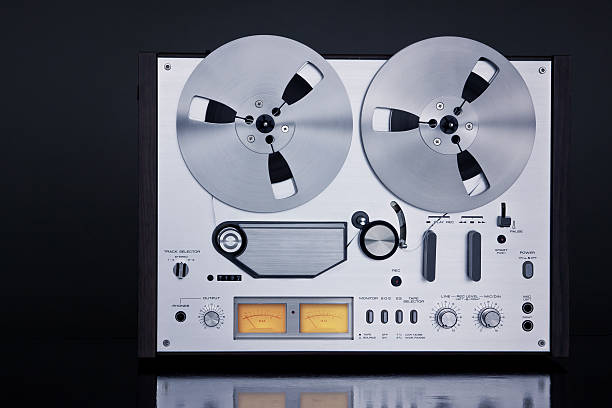 istock Analog Stereo Open Reel Tape Deck Recorder Vintage Closeup 519864041