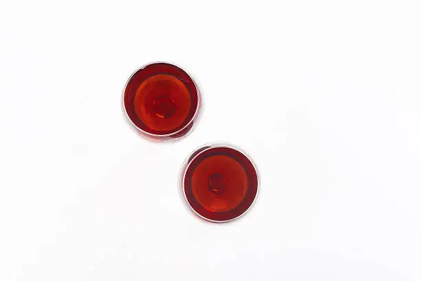 Photo of Two red wine glass isolated on white background