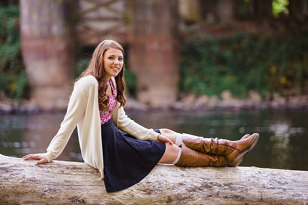 High School Senior Portrait Outdoors Teen girl poses for a high school senior portrait photo outdoors near a river in Eugene Oregon. high school photos stock pictures, royalty-free photos & images