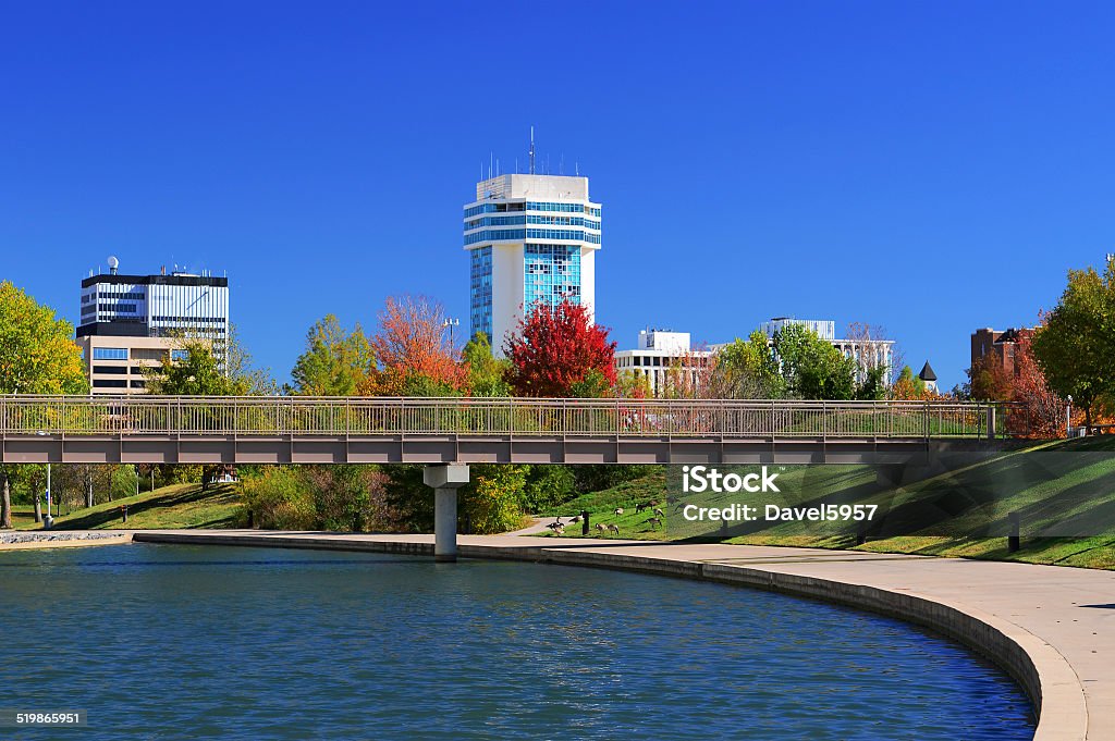 Wichita skyline and waterway Downtown Wichita skyline with a waterway and park in the foreground. Kansas Stock Photo