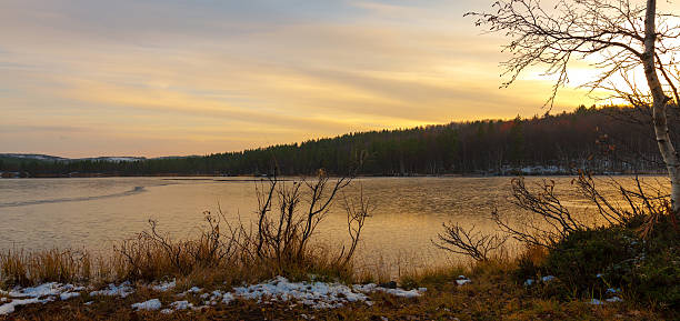 istock Sunset over frozen lake 519866209