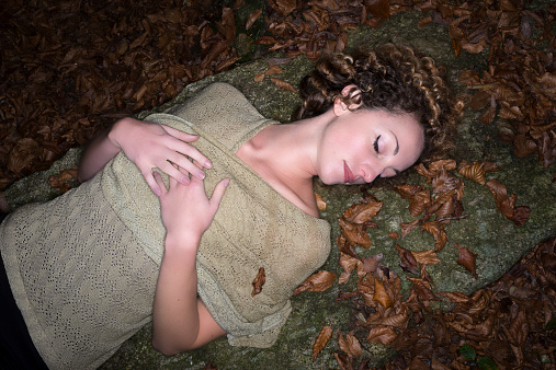 Beautiful woman in autumn forest
