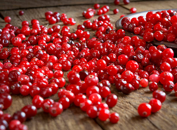 istock red cranberries on a wooden table 519866474