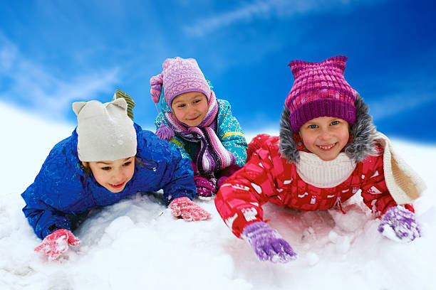 istock Winter fun, snow, happy children sledding at winter time 519867605