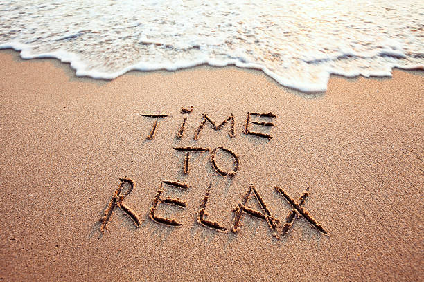 time to relax time to relax, concept written on sandy beach weekend trip stock pictures, royalty-free photos & images