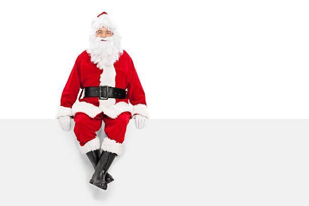 istock Santa Claus sitting on a blank billboard 519867679