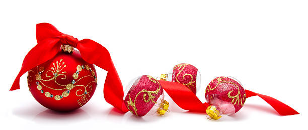 istock Red christmas balls with ribbon isolated on a white 519868303