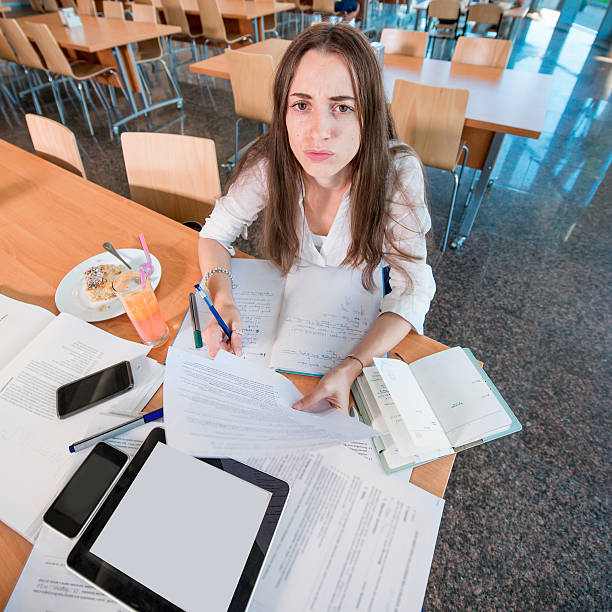 istock Girl studying hard at the University canteen 519868431