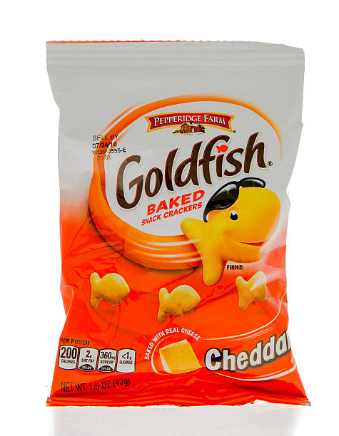 Goldfish Baked Crackers Winneconne, WI, USA - 1 March 2016: A bag of Goldfish baked crackers in cheddar flavor. goldfish snack stock pictures, royalty-free photos & images