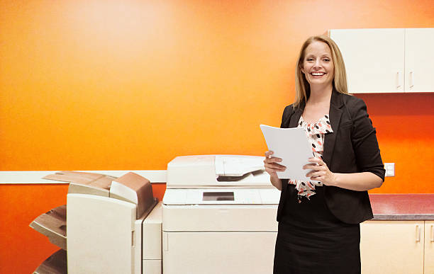 Smiling businesswoman holding documenthttp://www.twodozendesign.info/i/1.png