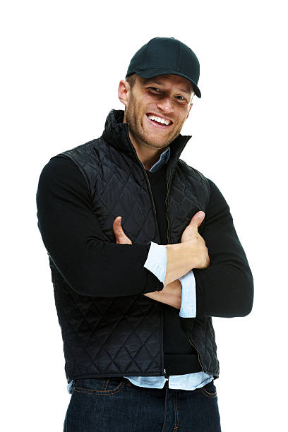 Smiling man standing with arms crossed