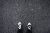 Canvas shoes on asphalt